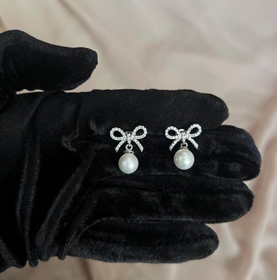Sterling Silver Pearl Bow Earrings: Elegant Ribbon Studs
