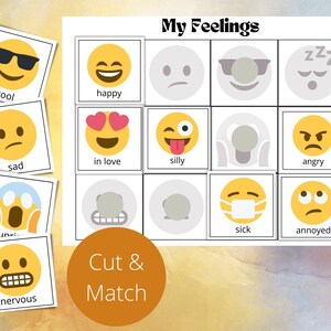 May include: A printable set of 12 cards featuring different emojis representing feelings. The cards are labeled with the corresponding feeling, such as "happy", "sad", "angry", and "nervous". The title of the set is "My Feelings" and there is a call to action to "Cut & Match".