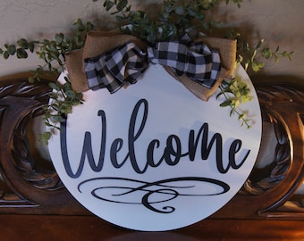 Welcome guests to your home with this beautiful door hanger
