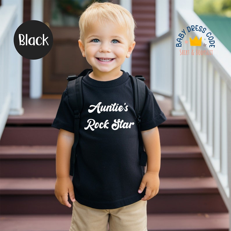 May include: A black t-shirt with white text that says "Auntie's Rock Star".