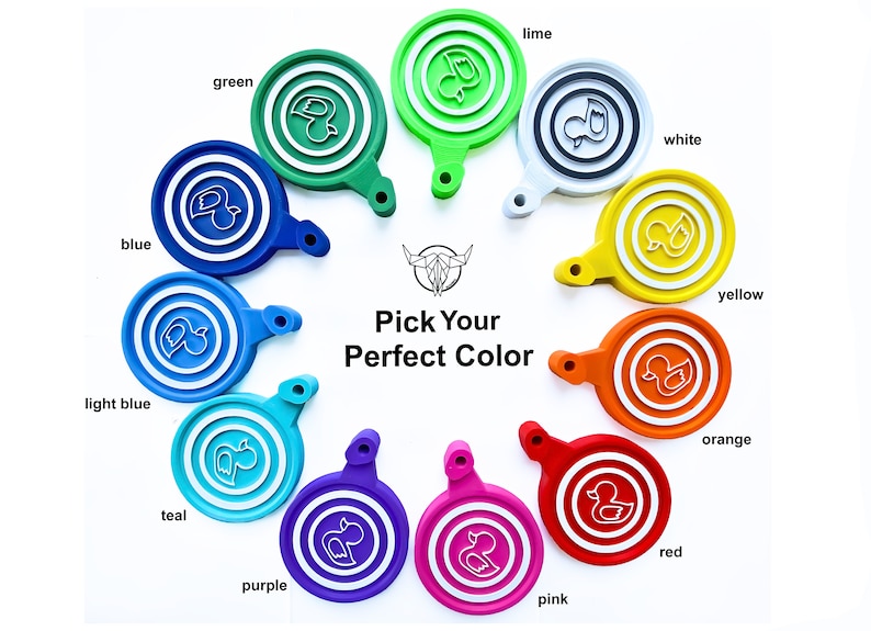 May include: A colorful display of ten round, plastic, duck-shaped keychains in various colors, including blue, light blue, teal, purple, pink, red, orange, yellow, white, and green. The keychains are arranged in a circle with the text "Pick Your Perfect Color" in the center.