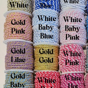 May include: A collection of twisted cord spools in various colour combinations including gold and white, royal blue and white, baby blue and gold, pink and gold, lilac and gold, red and white, hot pink and white, and solid gold or white.
