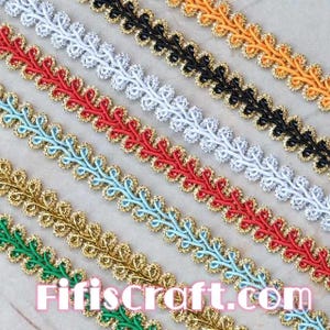 May include: Assortment of six colors of decorative trim with a leaf design. The trim is made of a woven fabric with a metallic thread running through it. The colors are green, gold, light blue, red, white, and black.