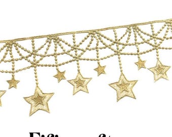 May include: Gold trim with a dangling star design. The trim features a repeating pattern of small beads and stars.