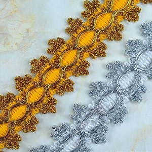 4.5 cm wide gold and silver snowflake trim by yard