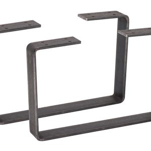 Könnte beinhalten: Zwei dunkelgraue, U-förmige Metall-Tischbeine. Jedes Bein hat eine rechteckige Oberseite mit vorgebohrten Löchern zur Montage und eine abgerundete Ecke. Die Beine bestehen aus dickem Metall und haben einen rohen, industriellen Look.