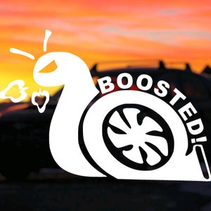May include: White vinyl sticker of a snail with a turbocharger for a shell. The snail is blowing smoke out of its nose. The text "BOOSTED!" is written around the turbocharger.