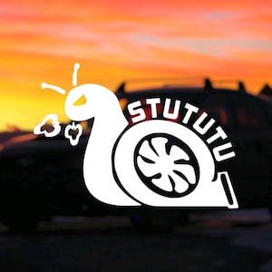 May include: A white snail sticker with a turbocharger design and the word "STUTUTU" on a black car against a sunset background.
