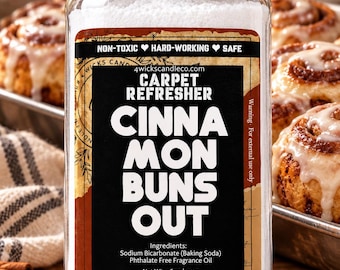 May include: A clear plastic jar with a black lid containing white carpet refresher powder. The label reads: 4wickscandle.com, CARPET REFRESHER, CINNAMON BUNS OUT, NON-TOXIC HARD-WORKING SAFE, Ingredients: Sodium Bicarbonate, Phthalate Free Fragrance Oil, Net Wt. 16oz.