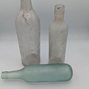 A Group of 3 Very Old Antique Bottles Recovered From a Dump Site, One With Curved Bottom
