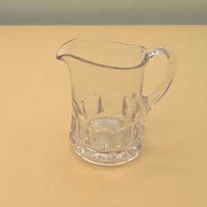 Antique Glass Creamer - UV Reactive, Arched Ovals, Concave Almond Design and a Starburst Bottom, ~1905