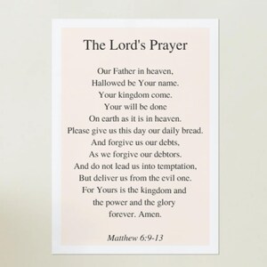 May include: A cream-coloured card featuring "The Lord's Prayer" in a serif font. The prayer is printed in black text, followed by "Matthew 6:9-13". The card's design is simple and elegant, suitable for religious use.