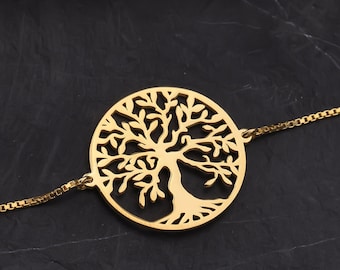 May include: A gold-toned chain bracelet with a circular pendant featuring a detailed tree of life design.