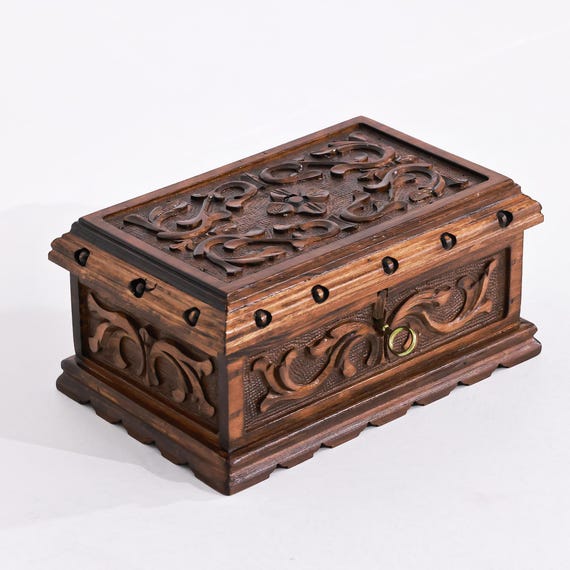 A hand-carved walnut puzzle box with a hidden key mechanism AND personalization — the 48 favorites and high-craft walnut material signal a real artisan piece that doubles as a heirloom jewelry box.