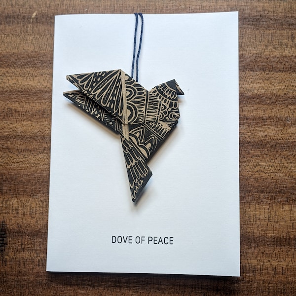 Hand printed origami peace dove decoration charity card, made with eco-friendly materials.