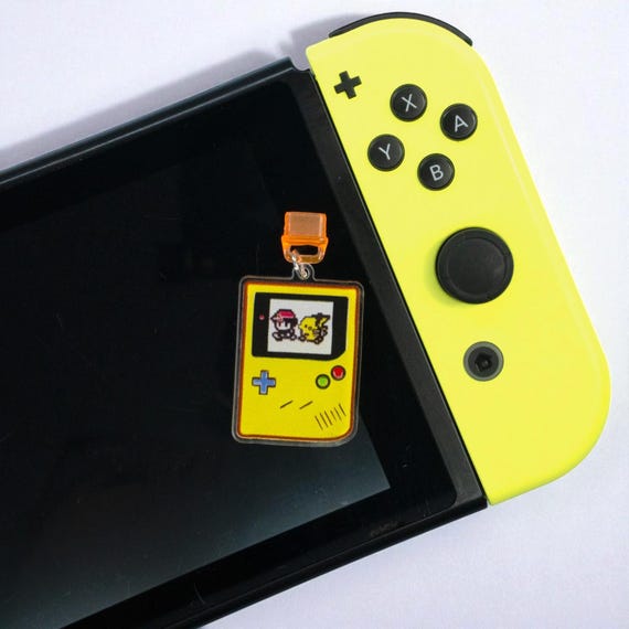 Retro Game Boy Dust Plug: Pikachu & Trainer Charm - USB-C, Lightning, Micro USB
