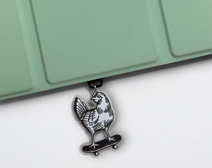 Featured listing image: Skateboarding Chicken Dust Plug Charm - USB-C, Micro USB, Lightning Port Cover for Kindle, iPad, Tablet, or Phone
