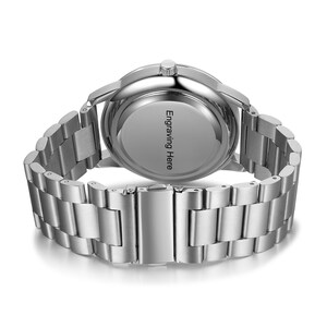 May include: Silver watch with a stainless steel band. The back of the watch has the text "Engraving Here" printed on it.