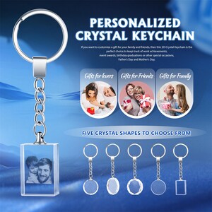 May include: A silver keychain with a crystal charm that can be personalized with a photo. The charm is rectangular and has a clear background. The keychain is shown with five different crystal shapes to choose from: round, oval, octagon, square, and rectangle.