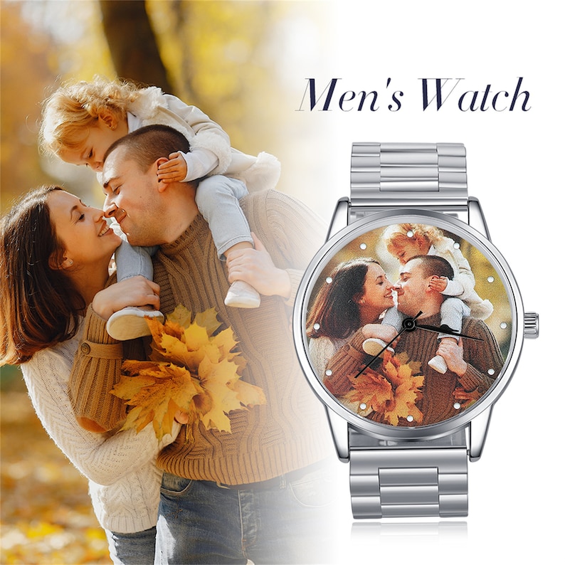 May include: A silver watch with a round face and a metal band. The watch face has a photo of a family of three, a man, a woman, and a child, with fall foliage in the background. The text "Men's Watch" is displayed above the watch.