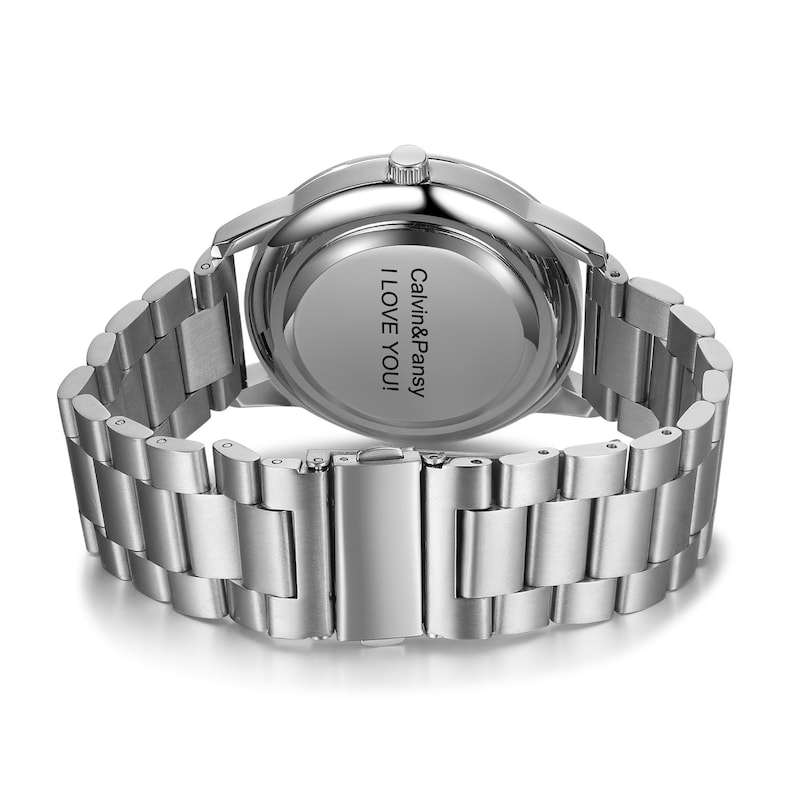 May include: Silver watch with a stainless steel band. The back of the watch has the text "Calvin&Pansy I LOVE YOU!" engraved on it.