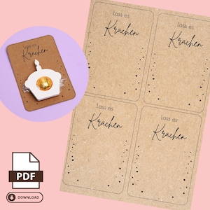 Peut inclure: Quatre étiquettes cadeaux imprimables avec un fond brun et des pois noirs. Le texte sur les étiquettes est "Lass es Krachen" qui se traduit par "Laissez-le craquer".