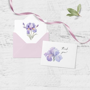 K&ouml;nnte beinhalten: Eine Dankeskarte mit einer Aquarell-Illustration einer violetten Iris-Blume. Die Karte hat einen wei&szlig;en Hintergrund und die Worte "Danke!" sind darauf geschrieben.
