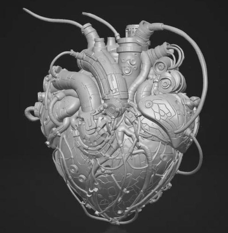 May include: A monochromatic gray sculpture of a human heart integrated with mechanical components. The anatomical structure features various tubes, wires, and metallic plates covering the surface, creating a complex, industrial, and cybernetic appearance.