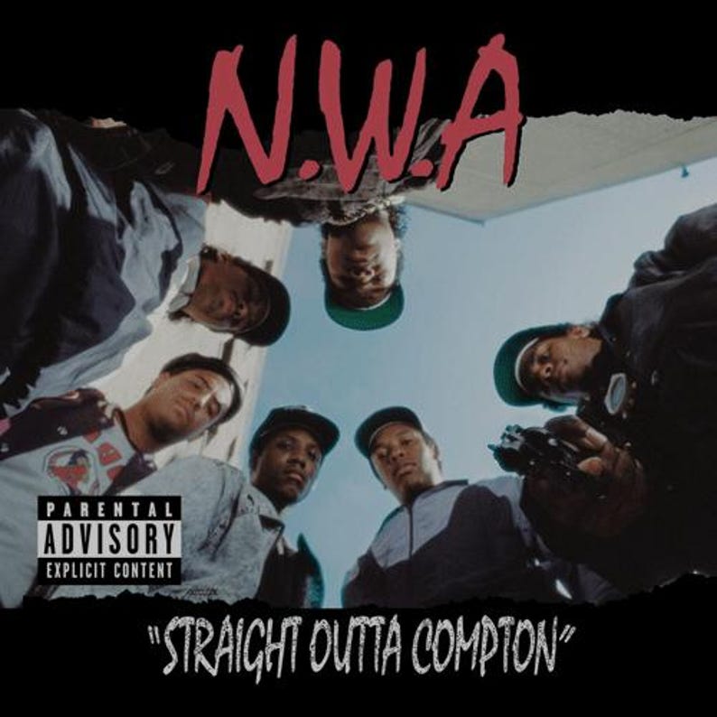 May include: The N.W.A Straight Outta Compton album cover features a low-angle shot of five individuals looking down, with the red text N.W.A at the top, a Parental Advisory Explicit Content label on the left, and the title at the bottom.