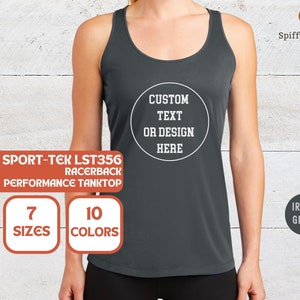 May include: A dark gray racerback tank top with the text "SPORT-TEK LST356 RACERBACK PERFORMANCE TANKTOP" and "CUSTOM TEXT OR DESIGN HERE" in white. The tank top is available in 7 sizes and 10 colors.
