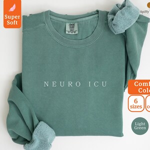 May include: Light green sweatshirt with the text "NEURO ICU" in white. The sweatshirt is made of a soft, comfortable fabric and is available in 6 sizes and 8 colors.