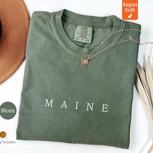 Camiseta de Maine, camiseta con colores cómodos, vacaciones en Nueva Inglaterra, regalo de orgullo estatal, camiseta con texto minimalista, recuerdo de viaje, amante de Maine