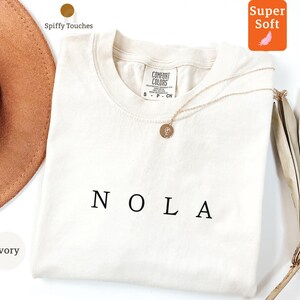 NOLA Ivory T-Shirt, Super Soft Comfortable Tee, Minimalist Graphic Shirt, Casual Wear Top, Classic Unisex Fit, Trendy Fashion