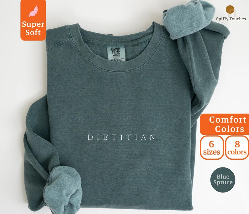 May include: A blue sweatshirt with the word "DIETITIAN" printed in white on the front. The sweatshirt is made of a soft, comfortable fabric and is available in 6 sizes and 8 colors.