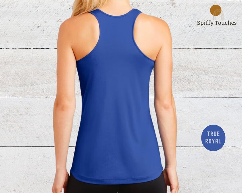 May include: A royal blue racerback tank top. The tank top is made of a soft, stretchy material and has a relaxed fit.