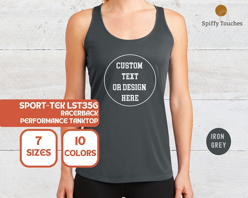 May include: A dark grey racerback tank top with the text "SPORT-TEK LST356 RACERBACK PERFORMANCE TANKTOP" and "CUSTOM TEXT OR DESIGN HERE" in white. The tank top is available in 7 sizes and 10 colours.