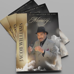 May include: A stack of memorial cards with a photo of a man in a suit and hat. The cards have gold and black text that reads "Jacob Williams" and "A Celebration of Life In Loving Memory". The background is a light gray.