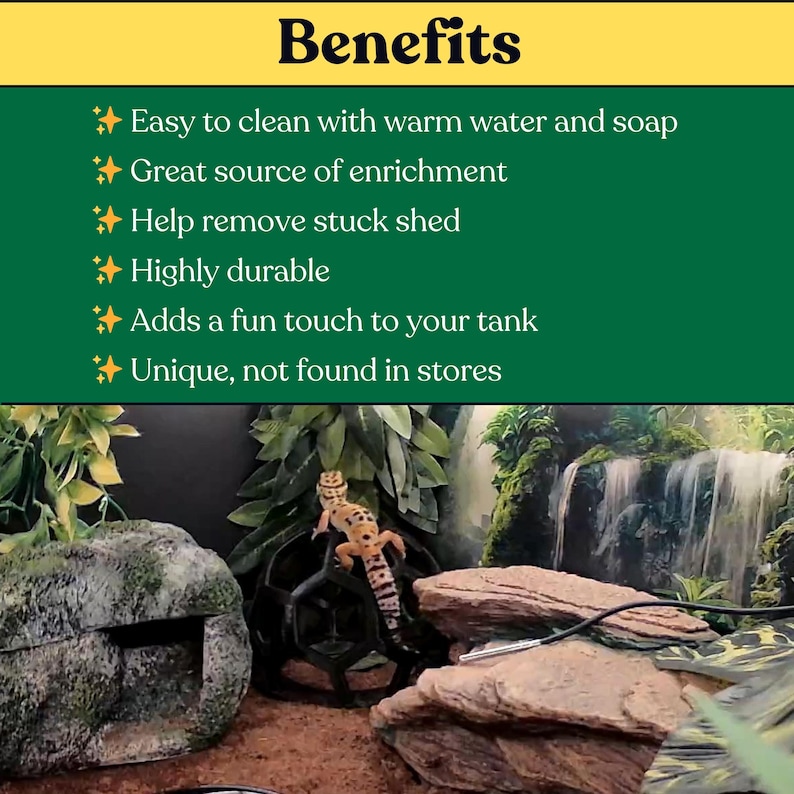May include: A leopard gecko climbs on a black geometric sphere inside a terrarium with a rock cave, artificial plants, and a waterfall background. The text reads: Benefits, Easy to clean with warm water and soap, Great source of enrichment, Help remove stuck shed, Highly durable, Adds a fun touch to your tank, Unique, not found in stores.