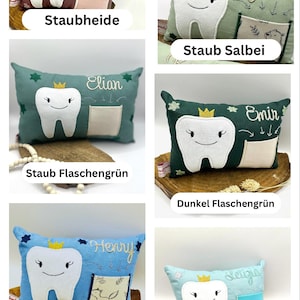 May include: A selection of tooth-shaped cushions in shades like dusty rose, sage green, teal, dark green, light blue, and aqua. Each cushion has a smiling tooth design, a crown, a name, and a small pocket.
