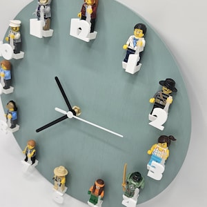 Clock for mini figure characters with green face.