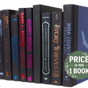 May include: A collection of ten hardcover books with black covers and colorful titles. The books are arranged vertically in a row. The titles include "Lullaby", "Gift of Griffing", "A Sinful Shade", "Dare is a Matter", "Hillary's America", "Cryptograpy", "A Darkness Strange & Lovely", "Story Thieves", "High Country", and "Nevada Barr".