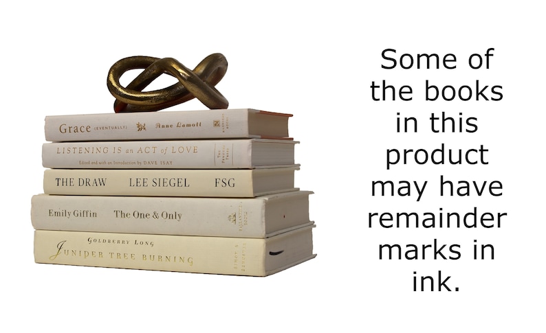 May include: A stack of five white books with gold lettering on the spines. The books are titled "Grace", "Listening is an Act of Love", "The Draw", "The One & Only", and "Juniper Tree Burning". A gold metal sculpture sits on top of the books. The text "Some of the books in this product may have remainder marks in ink." is visible to the right of the books.