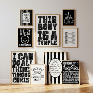Puede incluir: Una colección de arte mural enmarcado con citas y gráficos inspiradores en blanco y negro. El arte incluye frases como "Keep on Going", "This Body is a Temple" e "I Can Do All Things Through Christ". Los marcos tienen un borde dorado.