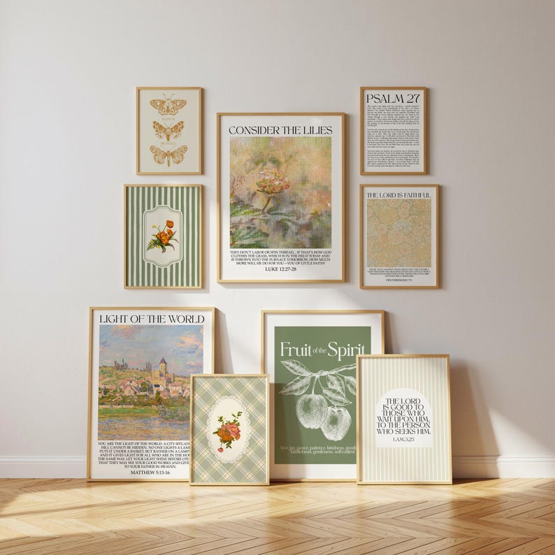 May include: A collection of framed art prints with a neutral color palette. The prints feature botanical illustrations, inspirational quotes, and landscape scenes. The artwork includes butterflies, flowers, and text that reads 'Consider the Lilies', 'Fruit of the Spirit', and 'Light of the World'.
