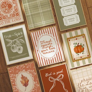 May include: A collection of decorative art prints with various designs and text. The prints feature floral patterns, plaid, and botanical illustrations. Some prints include phrases like "To the Lord," "Fruit of the Spirit," and "God is good."