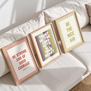 May include: Three framed art prints with inspirational quotes. One reads "Be Strong and of Good Courage," another "Trust in the Lord with All Your Heart," and the third "Be the Nice Kid." Each print has a wooden frame.