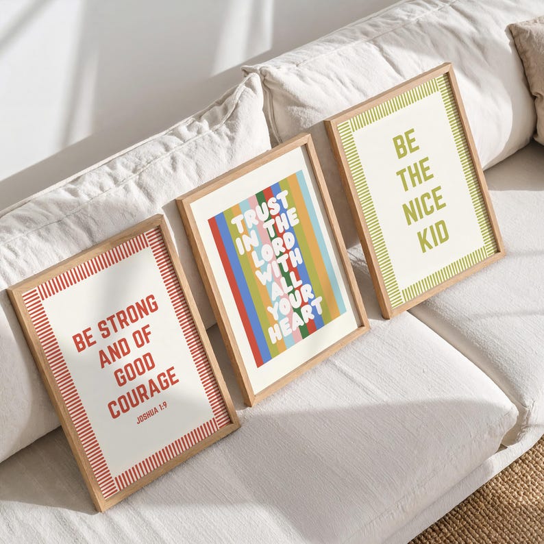 May include: Three framed art prints with inspirational quotes. One reads "Be Strong and of Good Courage," another "Trust in the Lord with All Your Heart," and the third "Be the Nice Kid." Each print has a wooden frame.