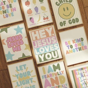 May include: A selection of framed art prints with motivational quotes and phrases in various colours. The prints feature phrases such as "Jesus Loves Me," "Be Kind to One Another," and "Let Your Light Shine."