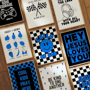 May include: A selection of framed art prints featuring motivational quotes and graphics. Designs include a games controller, checkered flags, headphones, a smiley face, and the text "Hey Jesus Loves You." The prints are in black, white, and blue.
