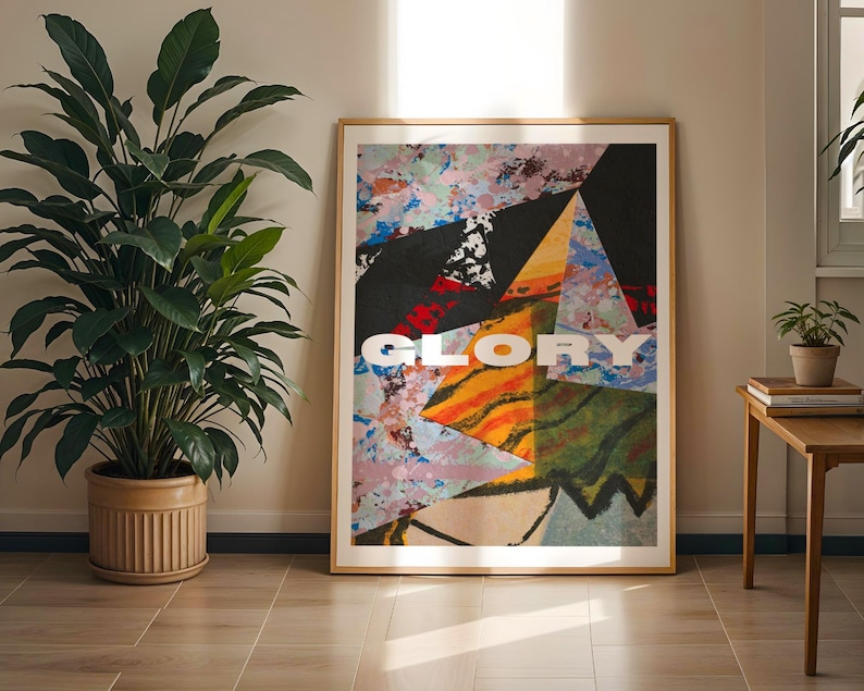 May include: A framed abstract art print featuring a colourful geometric design and the word "GLORY" in white lettering.